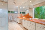 The fully remodeled master bathroom attached to the master bedroom encompasses all the elements required for you to melt into your dream vacation